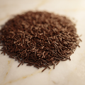 Fine dark chocolate vermicelli strands piled on marble